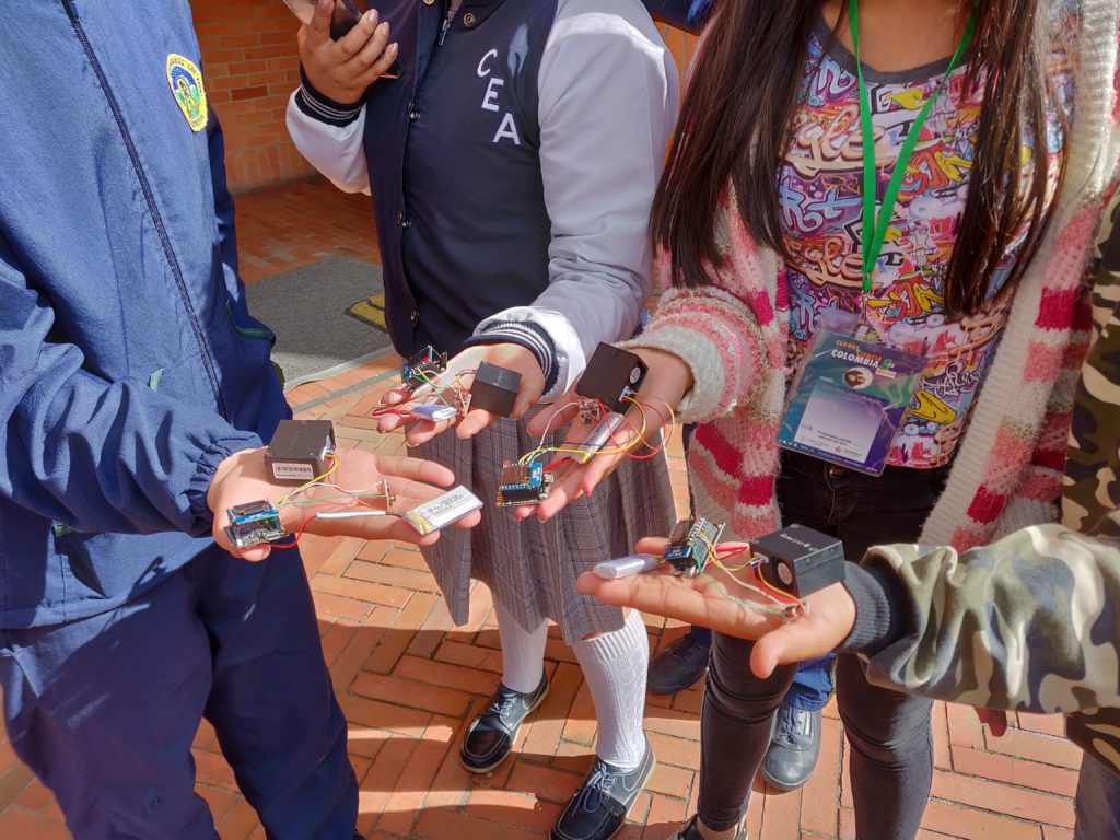 Children hold CanAirIO devices in their hands
